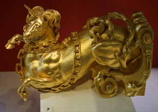 Carved and gilded wooden unicorn figurine bearing the Royal Arms