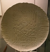 Porcelain dish by Wasma'a Chorbachi carved twice with the shahada