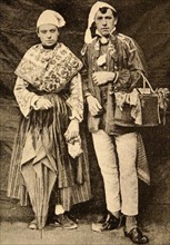two men in traditional Norman costume