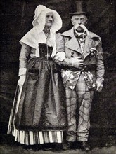 a husband and wife in traditional Norman costume