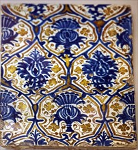Tin-glazed earthenware lustre tile