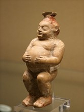 Terracotta perfume vessels in the shape of a fat dwarf