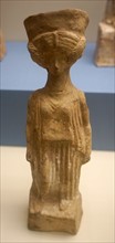 Terracotta figure of a woman wearing a Peplos and Polos crown
