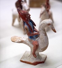 Terracotta figure of a man riding a goose