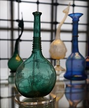 Blue glass bottle with applied ornament