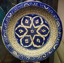 Bowl with six-petalled floral design and scale pattern