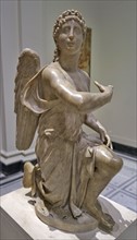 Statue of a kneeling angel possibly by Silvio Cosini