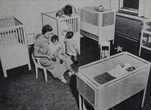 Photograph of nurses caring for children and infants at a child care centre