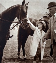 Princess Elizabeth stroking a winning horse