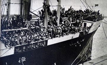 women and children being evacuated by boat during General Franco's reign