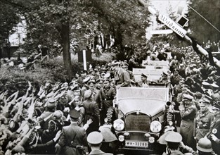 Adolf Hitler driving through crowds in Luhe-Wildenau
