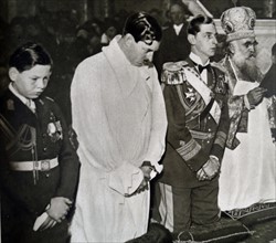 Crown Prince Michael and his Father King Carol of Romania during a mass in Bucharest.
