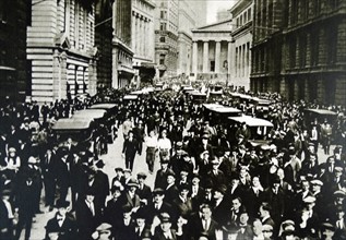 crowds gathering in Wall Street