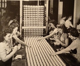 women working in a Golf Ball factory