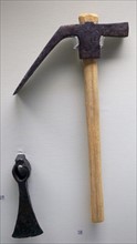 Dolabra with a reconstructed wooden handle