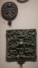 Ancient metal pins with openwork heads
