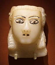 Carved stone head with coloured glass inlay from Ma'rib