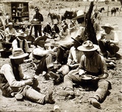 Cowboys at dinner dated 1907