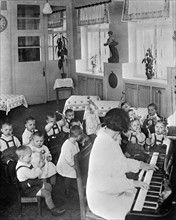 Nursery school children having music