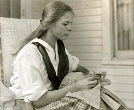 Betsey Price, First year High School at her club sewing