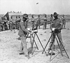 U.S. soldiers heliographing on the top of the Tartar City wall, Peking, China c1902.
