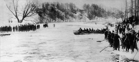 WWI German soldiers cross a river during the First Battle of the Masurian Lake.