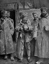 German prisoners of war take rations.