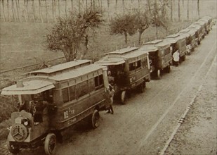 French military transport of troops by bus.