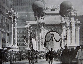 American troops marching under a Victory Arch in New York.