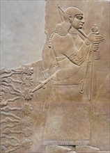 relief depicting a king and eunuch attendant