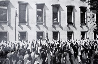 Nazi supporters gather to wave to Hitler