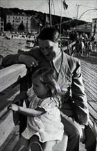 Adolf Hitler on a day at the coast, accompanied by Helga daughter of Dr Josef Goebbels