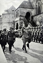 Adolf Hitler with an honour guard in 1934