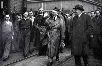 Adolf Hitler greets German labourers