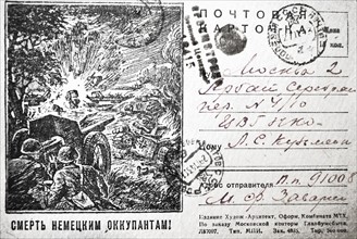Patriotic Russian war postcard depicting Russian soldier and tank in action destroying a German tank