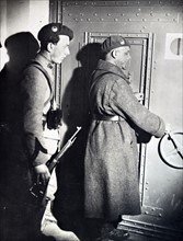 French soldiers close a reinforced door, 1940