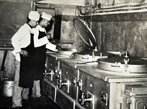 French military cooks prepare a meal in a kitchen, within the Maginot Line, France 1940