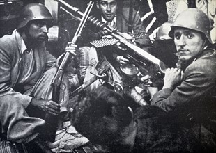 republican fighters shelter behind a barricade during the Spanish civil war 1937