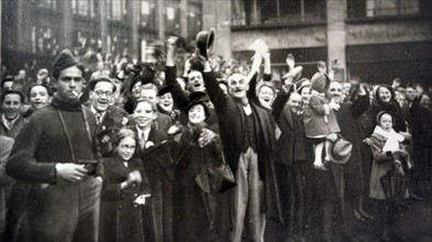 French crowds cheer American liberators in a town in Alsace Lorraine after liberation from Germany in WWII