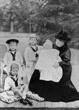 Photograph of Queen Victoria sat with her great-grandchildren