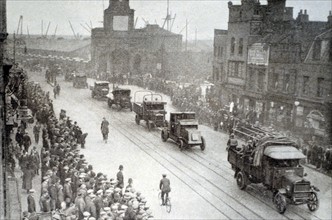 During the general strike of 1926, London crowds look on as troops pass through the streets