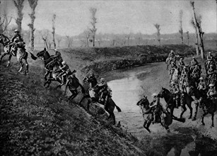 British cavalry charge across a river during WWI.