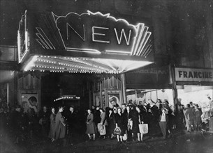 Baltimore, Maryland Thursday night shoppers in a line outside a movie theatre 1943