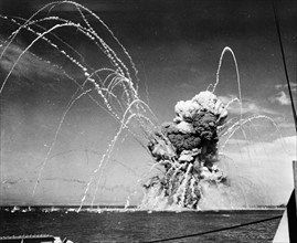 American cargo ship exploding after being hit by Nazi dive bombers