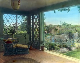 Sun-room overlooking walled garden by Frances Benjamin Johnston