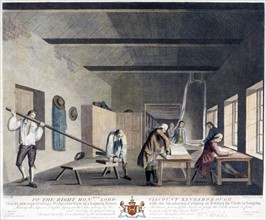 Mill or factory where several men are engaged in measuring, folding, and binding cloth into lengths
