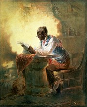 Black man reading newspaper by candlelight