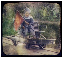 Turbaned man on railway hand car