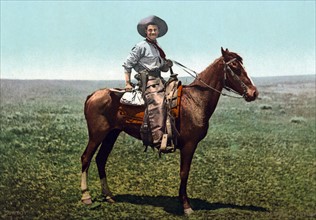 Cowboy on horseback, America 1900