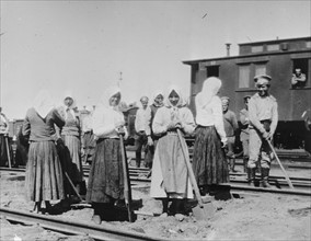 Russian women work on railway tracks